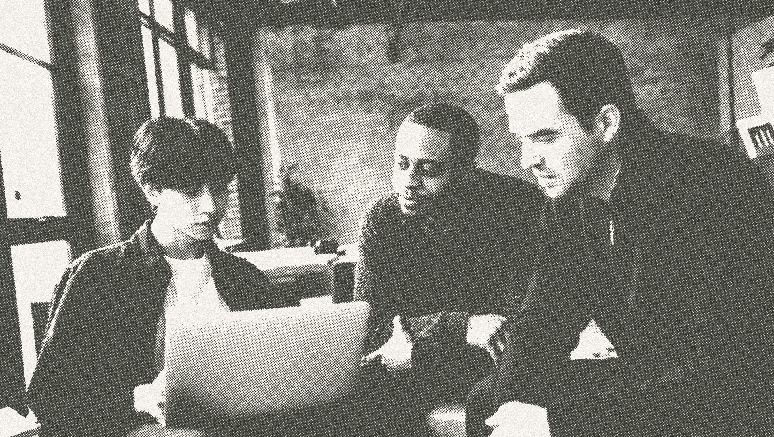 Three Origami engineers working together at a laptop